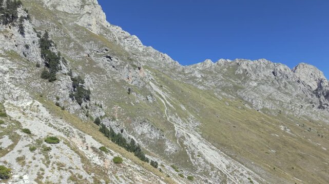 A hike day to the Albanian Mountains up to the border of Montenegro follow by a drone during Autumn or late summer season