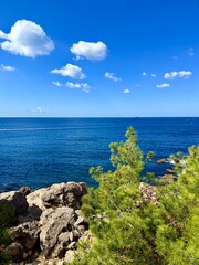fantastic blue seascape, rocky sea coast, blue sea and blue sky