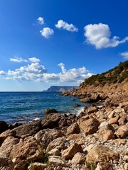fantastic blue seascape, rocky sea coast, blue sea and blue sky
