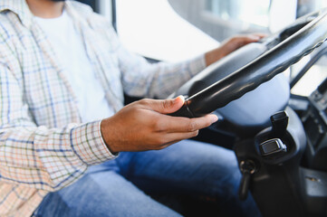 Professional driver holding steering wheel, operating vehicle