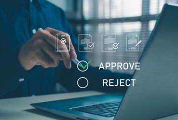 Businessman using laptop selecting approve option on digital document interface, concept of online approval workflow, e-signature process, business decision, and corporate digital management.