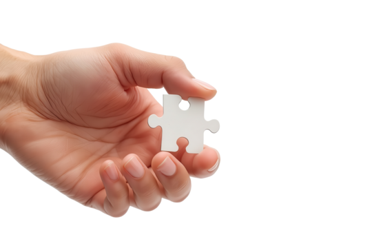A hand holds a white puzzle piece against a transparent background, symbolizing solutions and problem-solving.