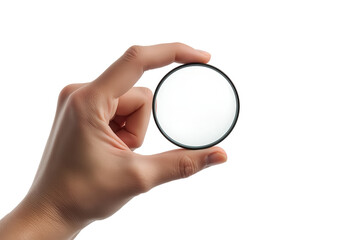 Hand holding circular photography filter against transparent background. The filter is white and black framed.