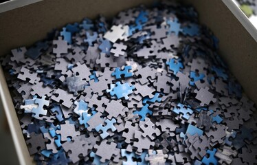 Many Puzzle Pieces On The Table For Assembly