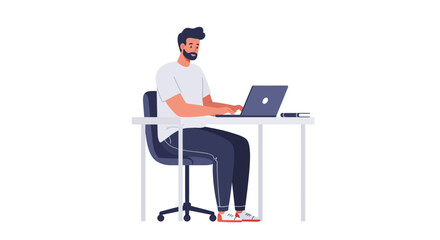 A man with a beard is sitting at a desk, working on a laptop computer.