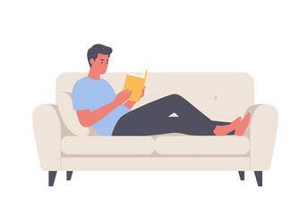 A man reclines on a sofa, engrossed in reading a book, enjoying leisure time.