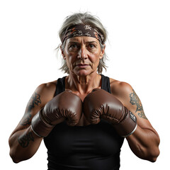 Senior woman boxing with determination and focus in studio setting  