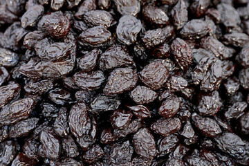 Closeup of a dried an smoked plum presented at a an agricultural products fair.