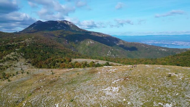 Aerial view of Mount Učka (Ucka) ridge with Vojak peak, winding mountain road, and autumn landscape near Brgud and Mala Učka, Istria, Croatia. Scenic panorama of Učka Nature Park