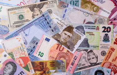 Paper money, banknotes of different countries as a business background. Paper money and cash