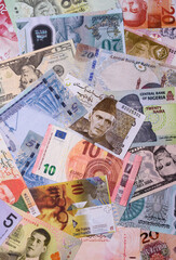 Paper money, banknotes of different countries as a business background. Paper money and cash