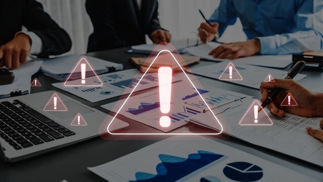 Professionals collaborate in a business meeting, surrounded by documents and graphs while alert signs emphasize the importance of critical information and strategic decisions. Raster