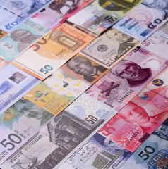 Paper money, banknotes of different countries as a business background. Paper money and cash