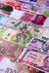 Paper money, banknotes of different countries as a business background. Paper money and cash
