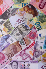 Paper money, banknotes of different countries as a business background. Paper money and cash