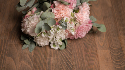 Bridal bouquet on a wooden table