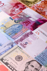 Paper money, banknotes of different countries as a business background. Paper money and cash