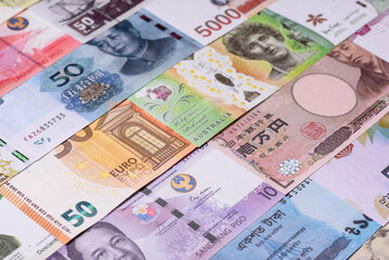 Paper money, banknotes of different countries as a business background. Paper money and cash