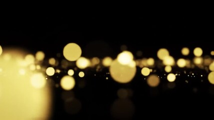 Golden Bokeh Particles Floating Against Black Background