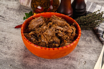 Shredded slow cooked pork meat