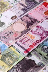 Paper money, banknotes of different countries as a business background. Paper money and cash