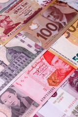 Paper money, banknotes of different countries as a business background. Paper money and cash