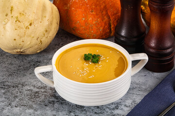 Vegan pumpkin cream soup served sesam