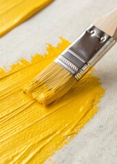 yellow paint brush on a white background