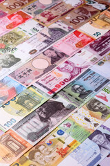 Paper money, banknotes of different countries as a business background. Paper money and cash