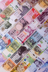 Paper money, banknotes of different countries as a business background. Paper money and cash