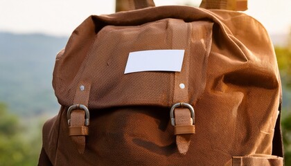 brown canvas backpack with customizable white badge outdoor adventure ready