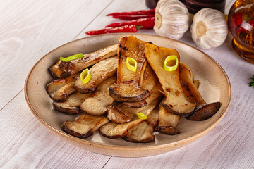 Roasted eringi mushrooms in the plate