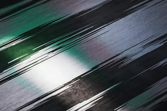 Diagonal brush strokes of green black and silver create a textured abstract background with a modern feel