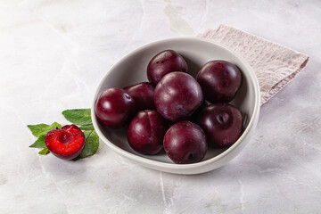 Raw ripe purple plum heap