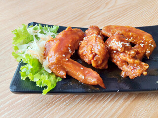 Delicious Crispy Chicken Wings Covered in Sweet and Spicy Barbeque Sauce