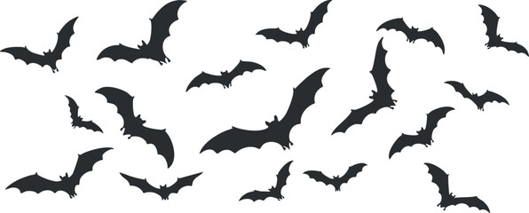 A collection of black bat silhouettes flying in a spooky Halloween scene.