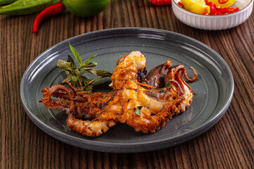 Gourmet grilled whole octopus served lime