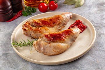 Roasted rabbit leg served rosemary