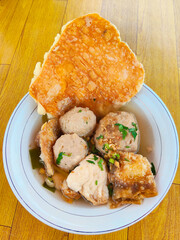 Traditional Indonesian Street Food Cuanki Served with Meatballs Broth Fried Tofu and Crispy Crackers