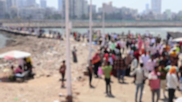 Bokeh view of people visit Haji Ali Dargah in Mumbai, India. Blurred background footage.