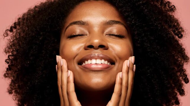 Closeup portrait of a smiling black woman with natural curly hair, touching her face with her hands, glowing skin vector illustration