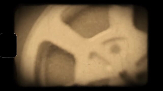 Vintage Film Reel Frame with Sepia Tone - A vintage film reel frame video in a sepia tone, showcasing a retro aesthetic. The video displays textures and scratches, emulating an old movie effect.