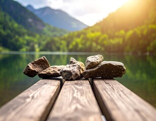Wooden dock with rocks on it, overlooking a lake and mountain range
