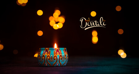 Festive Diwali setup with glowing colourful candles and decorative lights © sarath