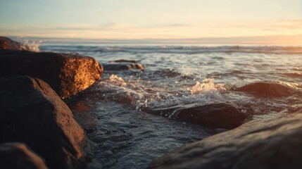 gentle waves hitting rocky shore at sunrise, warm soft lighting, cinematic depth, peaceful and emotional classical music ambiance