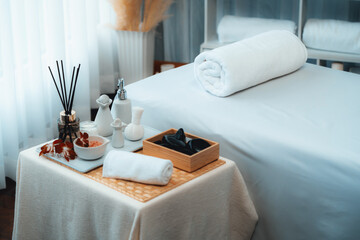 Exquisite display of beauty treatment and spa salon accessories arranged on spa table in luxury spa resort. Relaxing spa massage and recreation background concept. Quiescent