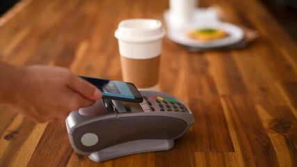 Person Making Contactless Payment with Smartphone for Coffee and Food in Coffee Shop, 4K Ultra HD Stock Video - Powered by Adobe