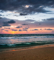 Tropical Beach with Empty Cage in the Sea at Sunset