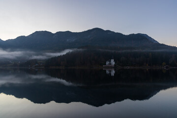The beautiful mountain lake Grundlsee at the southern foot of the Totes Gebirge mountains in the Styrian part of the Salzkammergut in Austria