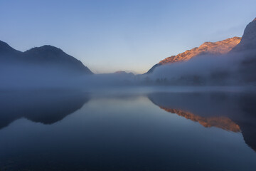 The beautiful mountain lake Grundlsee at the southern foot of the Totes Gebirge mountains in the Styrian part of the Salzkammergut in Austria